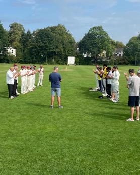An image showing the minute applause for former club president, Graham Martin.